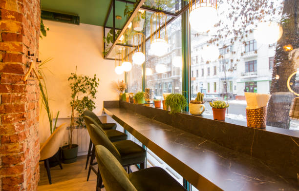 istock Coffee shop interior design With chairs and red bricks wall 1199671963