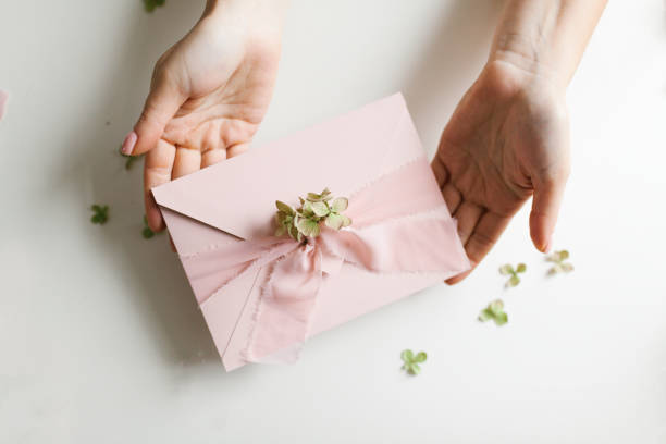 istock Beautiful light pink holiday card in envelope 1199672056