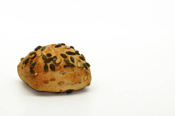 istock Healthy pumpkin seed bun exposed to white background 1199672877