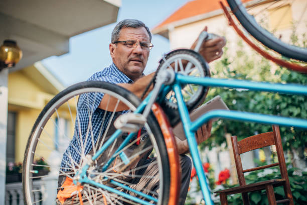 istock Senior men repair bicycle 1199673007