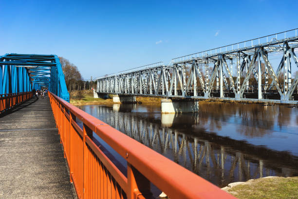 istock Pedestrian and railway bridges over the river 1199673874