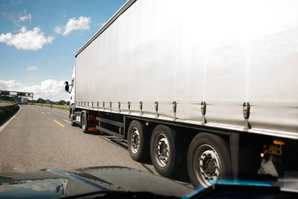 istock Driver's point of view while overtaking a Cargo Truck on a Highway 1199675335
