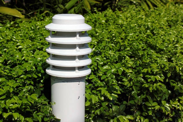 istock Garden lamp against green leafy bush background 1199675373