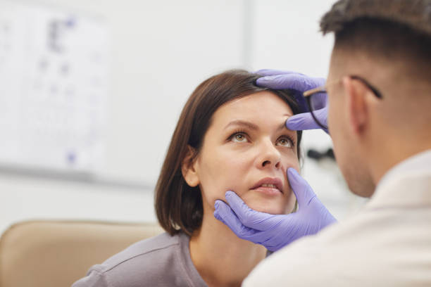 istock Ophthalmologist Examining Eyes 1199676222