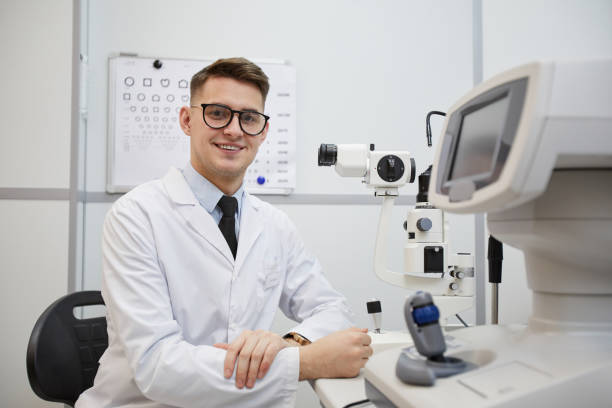 istock Male Optometrist Smiling at Camera 1199676246