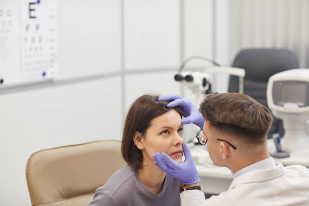 istock Ophthalmologist Examining Eyes in Clinic 1199676247
