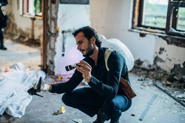 istock Detective at the crime scene looking for evidence 1199676796