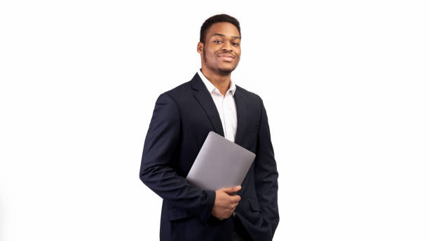 istock Handsome black man holding laptop on white background 1199676906