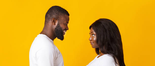 istock Black girl and guy looking at each other 1199676975