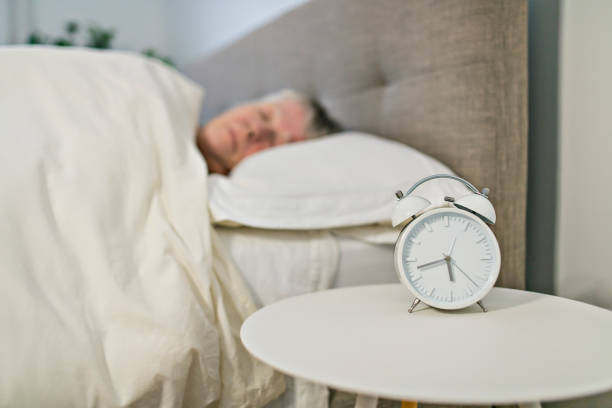 istock A Senior woman having sleep disorder, lying in bed 1199677212