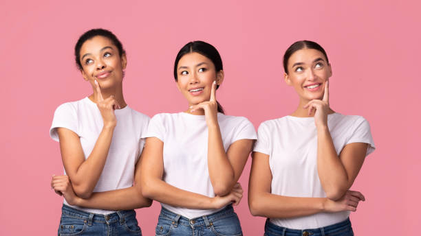 istock Three Girls Thinking Touching Chin Posing Over Pink Background, Panorama 1199678227