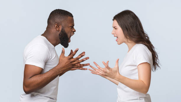 istock Furious multiracial couple yelling at each other, emotionally arguing and gesturing 1199678495