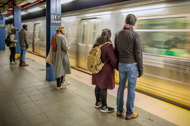 81 Street Museum of Natural History Station, Manhattan, New York, USA, December 5, 2019:  People waiting for the arriving subway