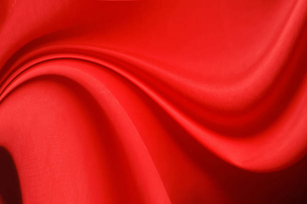 istock Red fabric sheets background or texture, abstract with waves, Soft focus cloth silk Red 1199680889
