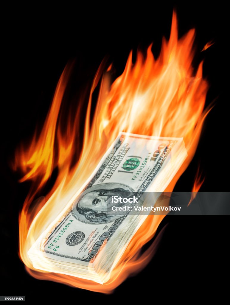 Burning one-hundred dollar bills in flames on black background. Burning one-hundred dollar bills in flames on black background. Conceptual picture. American One Hundred Dollar Bill Stock Photo