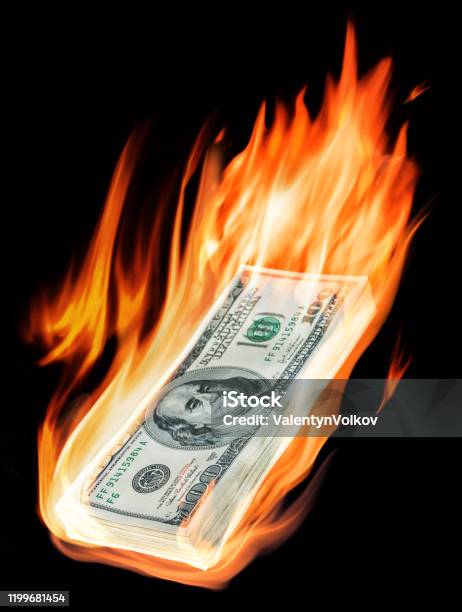 Burning Onehundred Dollar Bills In Flames On Black Background Stock Photo - Download Image Now