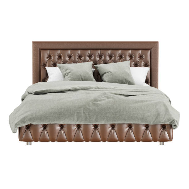 istock Classic-style bed with brown quilted leather upholstery and gray-white bedding on a white background. 3d rendering 1199683215