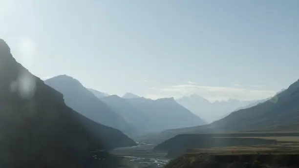 Beautiful sun light reflection in sunset dusk falling on Silhouette Mountain valley. Kashmir Valley, Jammu and Kashmir, India Asia Pacific