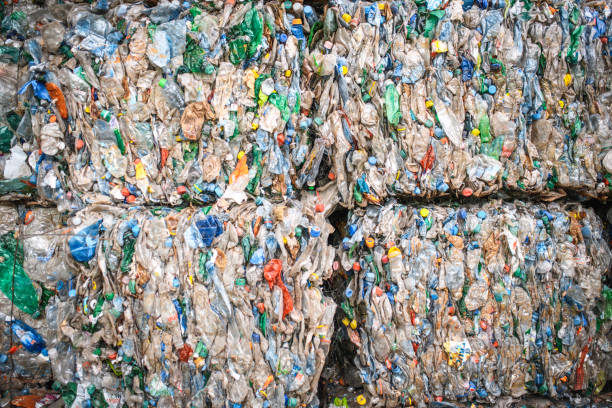 istock Bales of Compressed Recyclable Materials Stacked Outdoors 1199683622