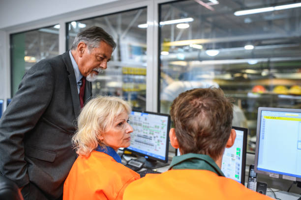 istock Workers and Manager in Waste Management Control Room 1199683644