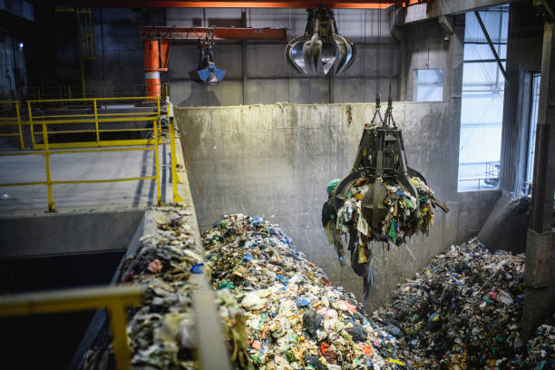 istock Mechanical Grabber in Use Transferring Municipal Waste 1199683662