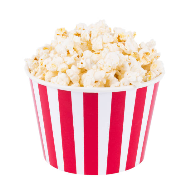 istock Popcorn in red and white cardboard box for cinema isolated on white background 1199687501