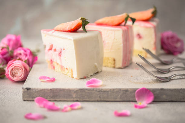 istock Strawberry mousse cake, cheesecake with fresh strawberries on light  background. Tasty strawberry mousse cake with biscuit layers and strawberries. mousse layer. 1199687520