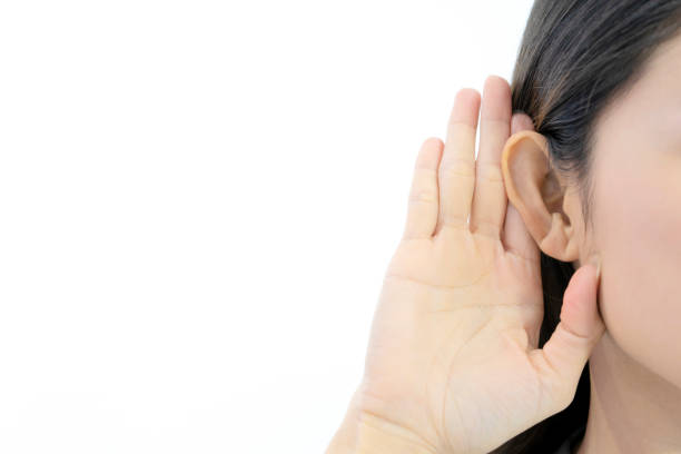 istock hand near ear and listens carefully 1199687951