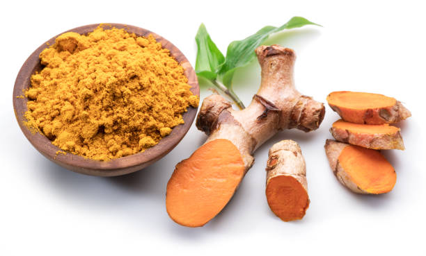 istock Fresh turmeric rhizome and turmeric powder isolated on white background. 1199688212