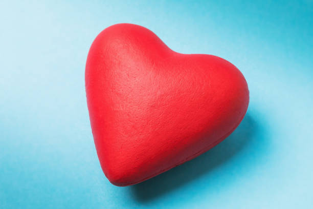 istock Red heart on a blue background, top view 1199689050