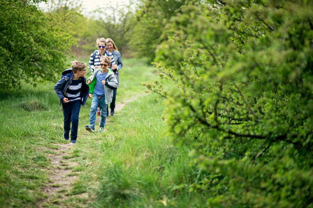 istock Family running in nature and enjoying spring 1199689384