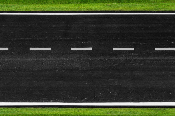 asphalt road with marking lines white stripes texture background - road top view imagens e fotografias de stock