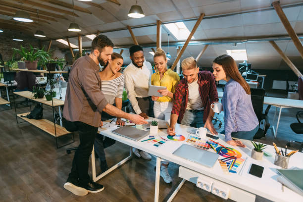 istock Designers discussing new startup, choosing color from palette 1199691354