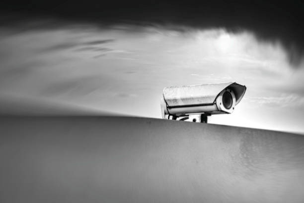 Surveillance camera at gloomy sky