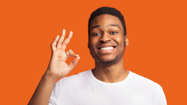 istock Happy black guy gesturing ok sign and smiling 1199691505