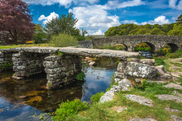 Medieval clapper bridge Medieval clapper bridge over the East Dart River at Postbridge on Dartmoor in Devon, West Country, England, UK dartmoor photos stock pictures, royalty-free photos & images