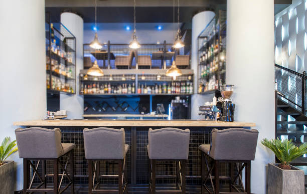 istock Half-lighted hall in a loft style in urban cafe with open bar counter 1199692520