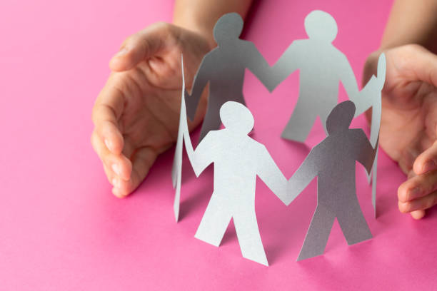 istock Hand Protecting Paper Cut Out Figure 1199692635