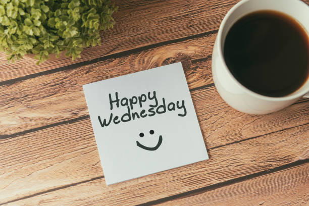 Happy Wednesday greeting Happy Wednesday with smile greeting on paper note with cup of coffee hello single word photos stock pictures, royalty-free photos & images