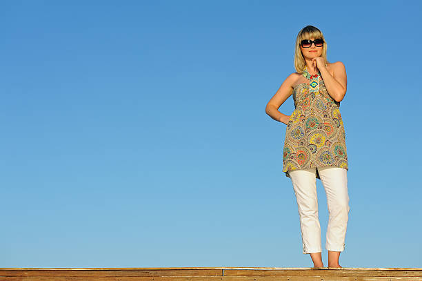 istock Young woman standing on bridge 119969735