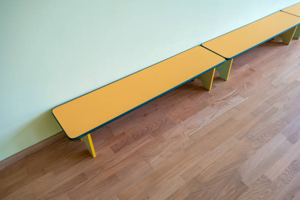 istock Yellow benches inside a school sports gym. 1199697596