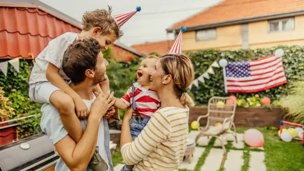 Photo of Happy family celebrating Fourth of July
