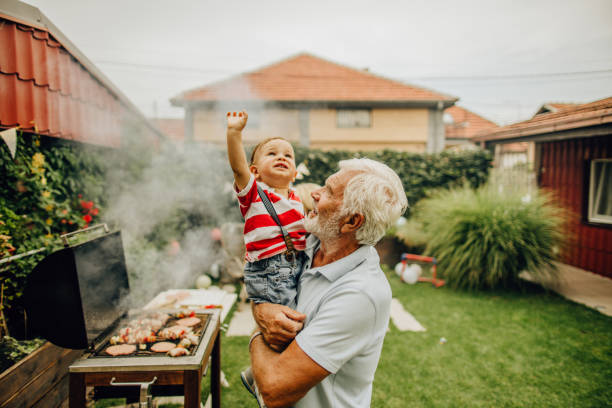 With grandfather at the barbecue party