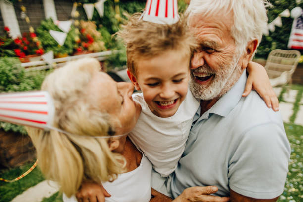 istock Smiling senior couple and their grandson 1199703347