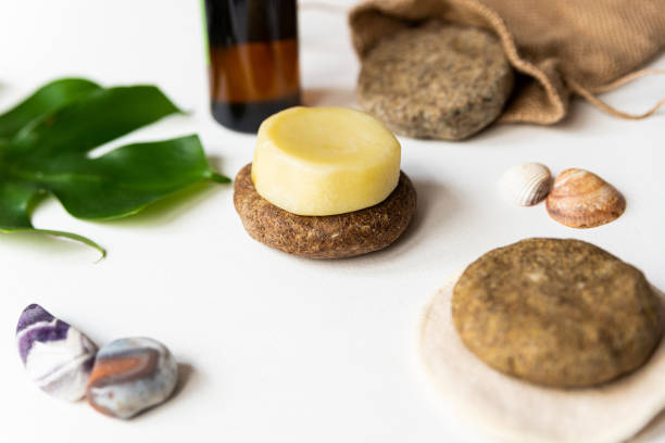istock homemade solid shampoo discs close up with green natural leaf, example of natural and ecological plastic free cosmetic, homemade with herbs 1199704576