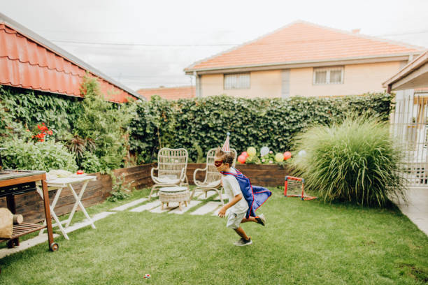 istock Little superhero in the yard 1199704615