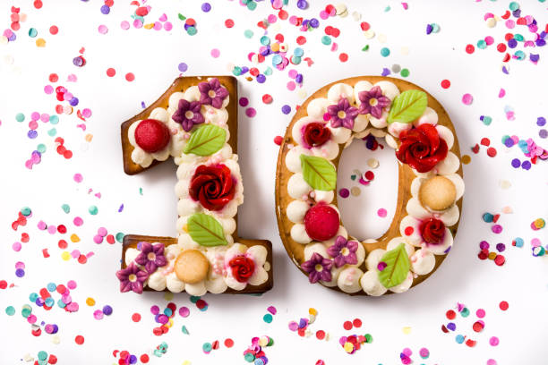 istock Number ten cake decorated with flowers and macarons 1199705297