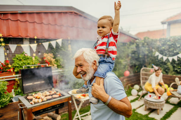 istock With grandfather at the barbecue party 1199706083