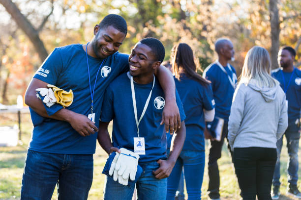 istock Father and son bond during charity cleanup day 1199706285