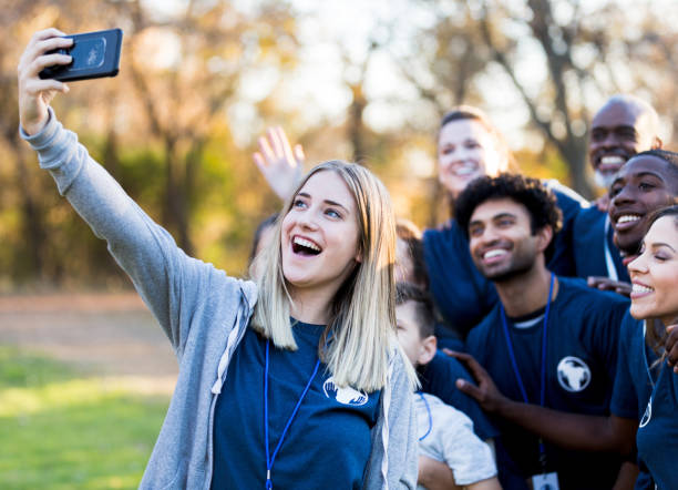 istock Volunteers take selfie during charity event 1199706294